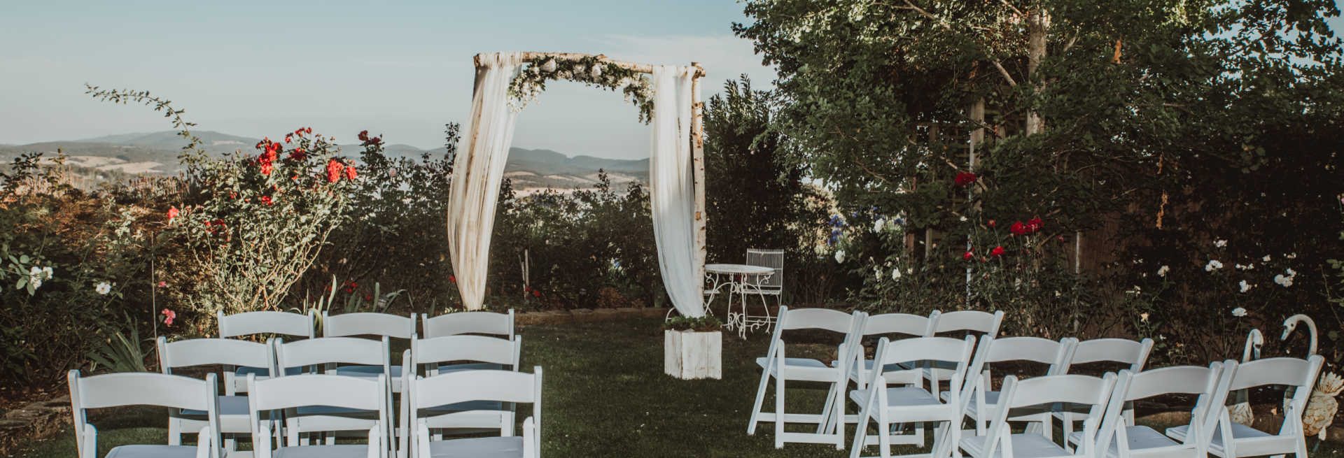 A wedding ceremony setup amongst the trees overlooking the Yarra Valley